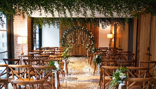 wedding ceremony flowers with flower arch